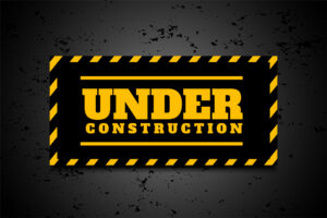 under construction industrial background in yellow black stripes